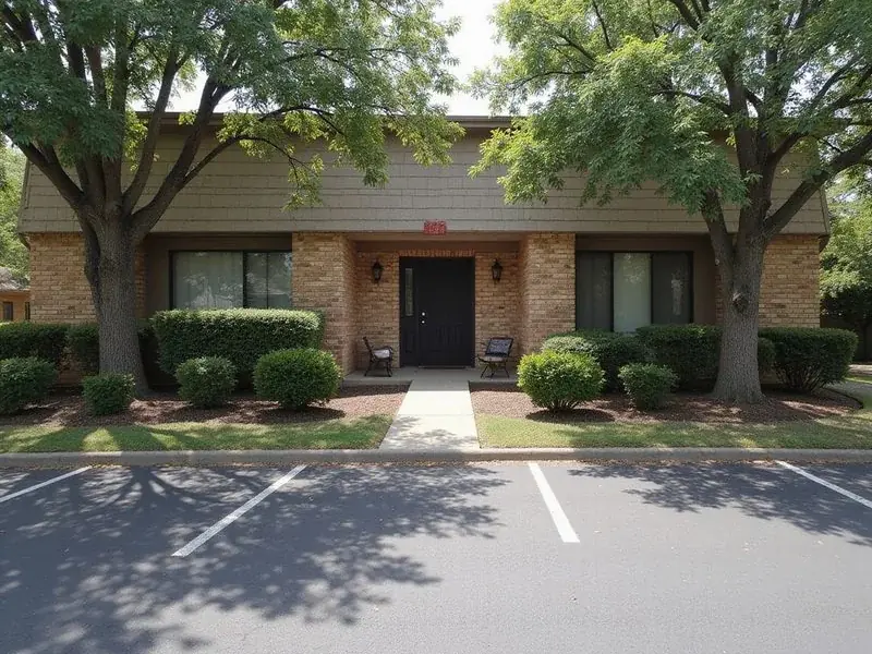 A garden apartment building with a brick exterior